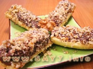 Bananas stuffed with nuts in chocolate
