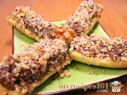 Bananas stuffed with nuts in chocolate