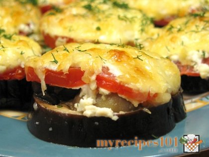 Baked eggplants with tomatoes and mushrooms