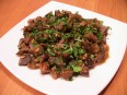 Fried chicken stomachs with onion and...