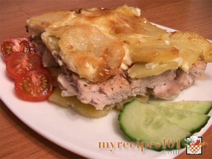 Meat with potatoes under mayonnaise