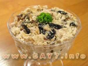Salad with chicken filet, dried plums and nuts