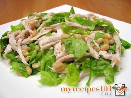 Salad with chicken filet and cedar nuts