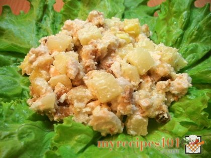 Salad with chicken filet, croutons and pineapples