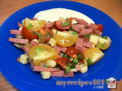 Salad with sausage, cheese and tomatoes