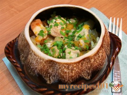 Cabbage, potatoes and chicken filet in a pot